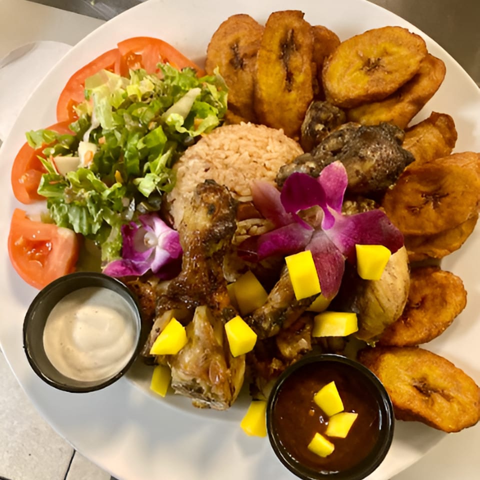Hazel's Jamaican jerk chicken with rice, plantains, salad, and mango salsa.